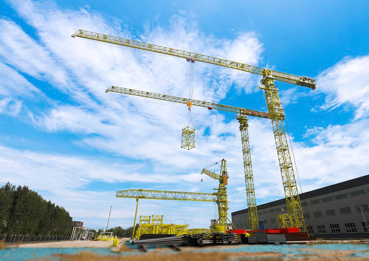 crane towers are working on construction sites